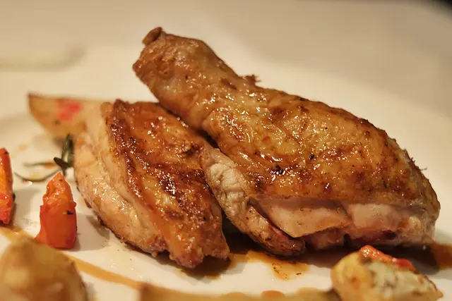 Bresse chicken: French chicken, brined for 12 hours and oven roasted, juicy; served with a medley of roasted root vegetables, new potatoes