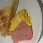 Buttered toast with ham and scrambled eggs