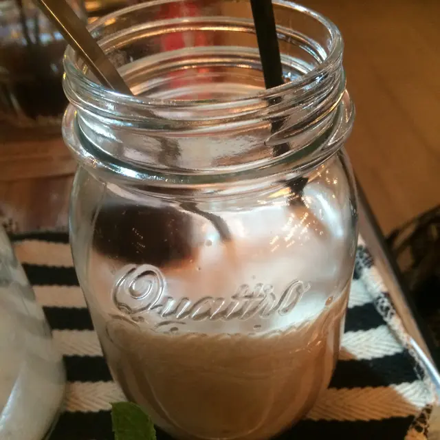 Add the orange peel and peppermint leaves , stirred these garnishes with the chocolate ice cubes