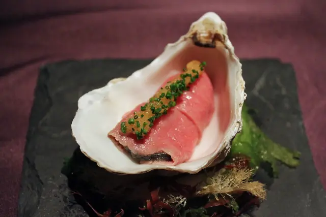 Poached Gillardeau oyster wrapped with shabu-shabu Wagyu beef and grated celeriac jelly