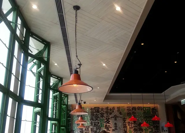 牆上寫着店的起源和介紹