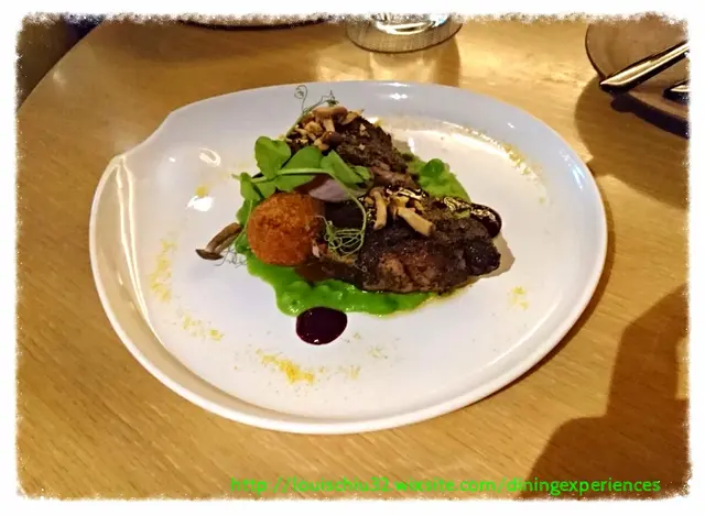 Coffee crusted Australian pork loin (Red cabbage, crushed green peas, Toasted corn, pickled shimeji, Pull porked croquette)