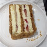 Beautifully layered with pastry, strawberries and soaked sponge cake