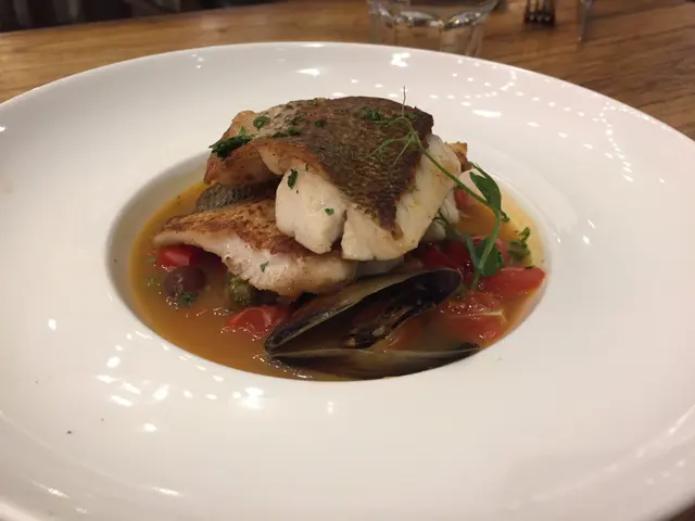 Sea Bass in Seafood Consomme with Olives, Capers, Cherry Tomatoe