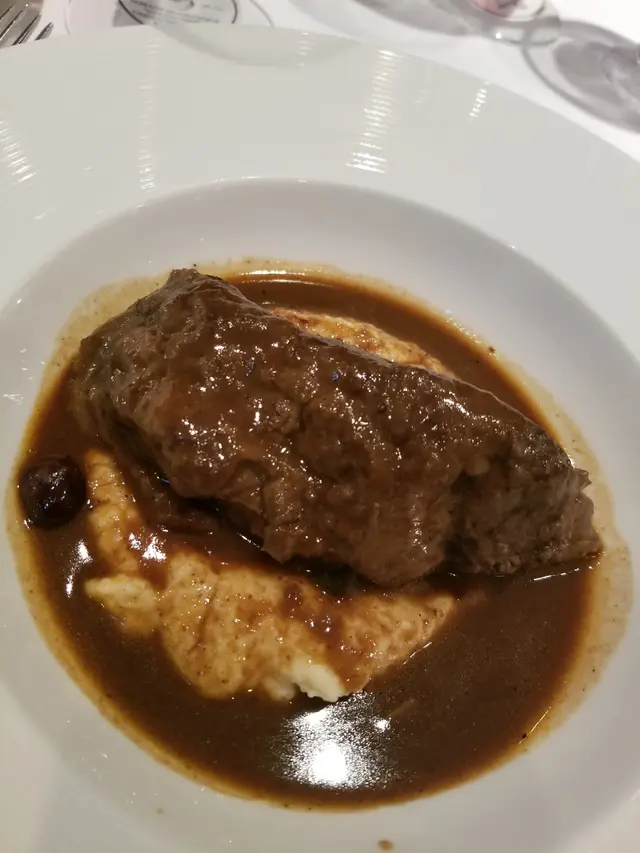 Braised Rump of Lamb Polenta, Red Wine Jus and Blue Berries