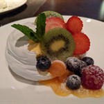 Hard sweet interior with a mix of mouse and cream inside. Served with fresh fruit albeit not too sweet, which created a great balance