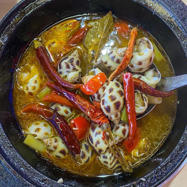 辣酒煮東風螺