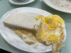 Buttered  plain  bread  with 2 x  pan  fried  eggs  