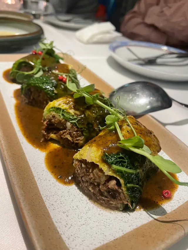 Pork cheeks cabbage “Trouxa” in a red pot and truffle sauce 