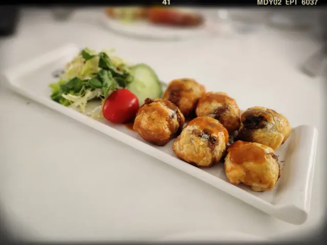 酥皮焗田螺（$108）