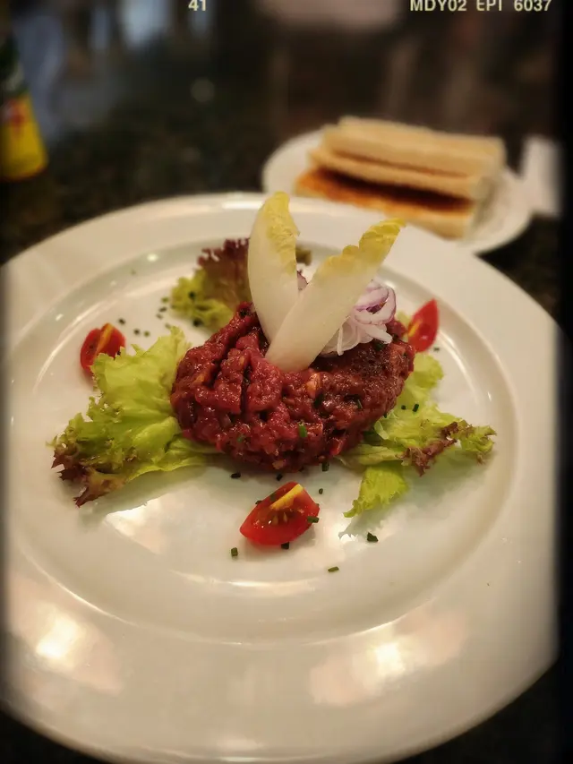 Beef Tartar flavored with Calvados with toast