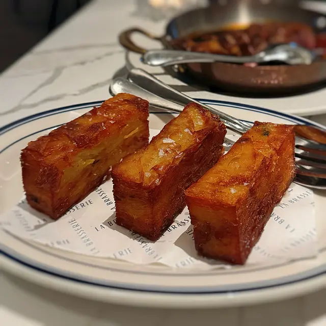 Crispy layered potatoes with thyme & rosemary