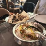 The duck confit is succulent, has a rich, savory depth perfectly complementing the aromatic rice, very fluffy & infused with spices, elevating the classic biryani experience. Creates a luxurious dish that feels both comforting & sophisticated.