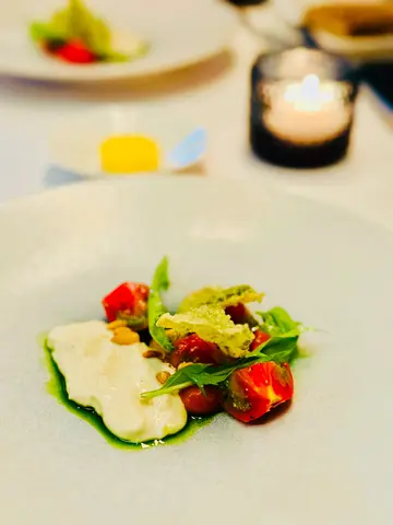 Japanese fruit tomato with pine nut butter, yuba, miso, basil oil and mizuna salad