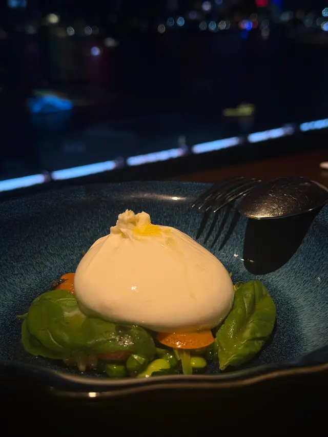 Burrata with peas, fava beans, pine nuts and mandarin