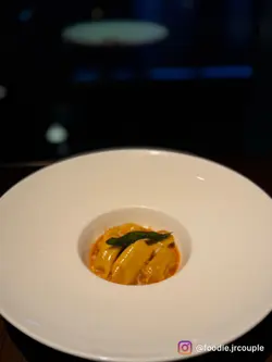 braised duck “ravioli del plin”, duck jus, parmigiano fondue and crispy sage